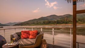 Sip coffee while Laos floats by – included in every tour